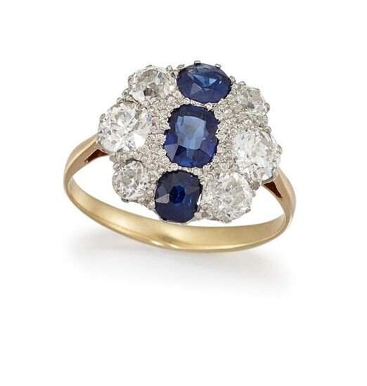 A SAPPHIRE AND DIAMOND CLUSTER RING
