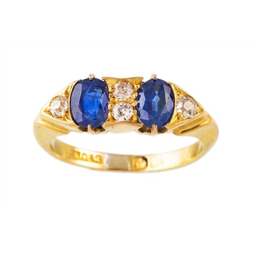 A SAPPHIRE AND DIAMOND FIVE STONE RING, set with oval sapphi...