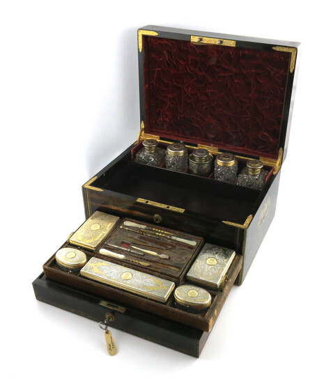 A Victorian silver-gilt mounted travelling dressing table set