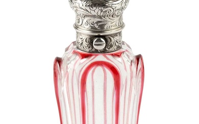 A Victorian silver mounted glass scent bottle, of waisted and...