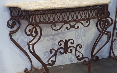 A WROUGHT IRON BASED MARBLE TOP CONSOLE TABLE