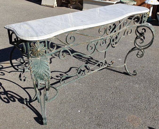 A WROUGHT IRON BASED MARBLE TOP CONSOLE TABLE