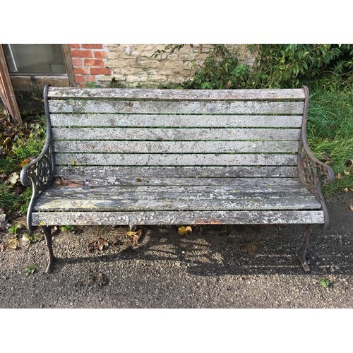 A cast iron garden bench with lion head design panels, 148cm...