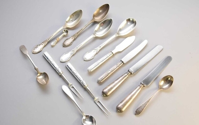 A collection of silver and white metal cutlery