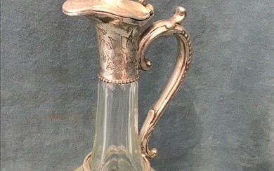 A cut glass globular claret jug with porthole and greek...