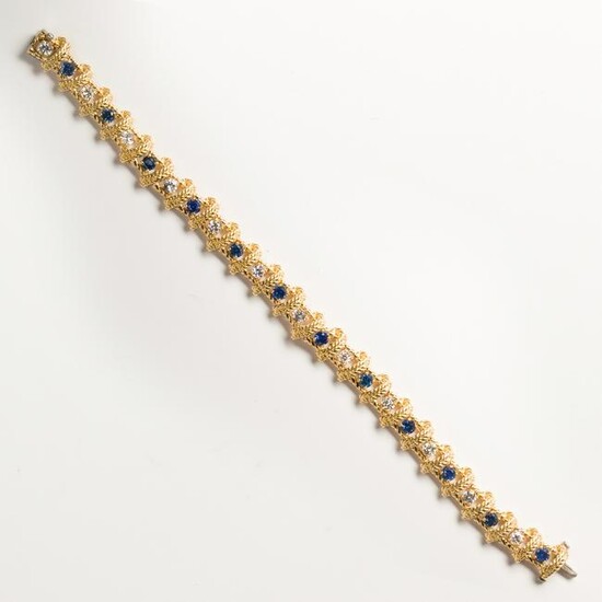 A diamond, sapphire and eighteen karat gold bracelet
