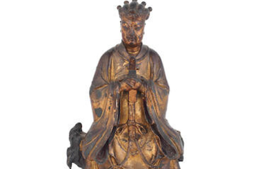 A gilt and lacquered wooden figure of an official on bronze stand