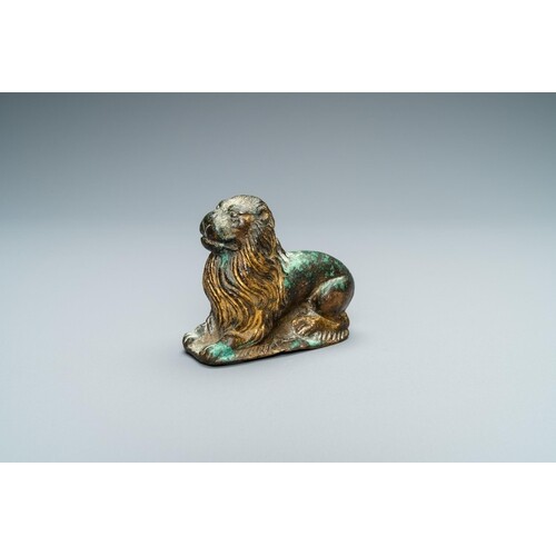 A gilt-bronze model of a recumbent lion, France, 14th C.L.: ...