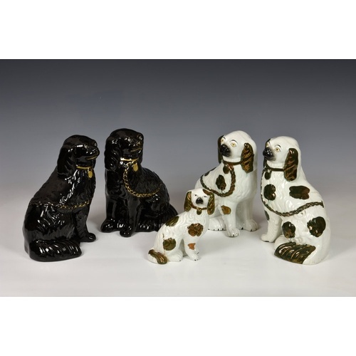 A group of five 19th century Staffordshire dogs, comprising ...