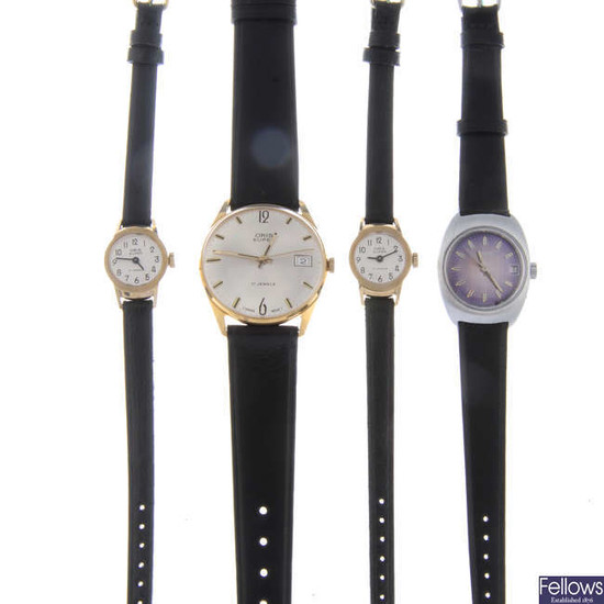 A group of five assorted watches and four assorted watch movements.