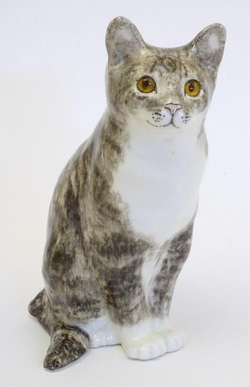 A large Winstanley model of a seated cat. Marked under
