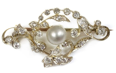 A late Victorian pearl and diamond scrolling brooch