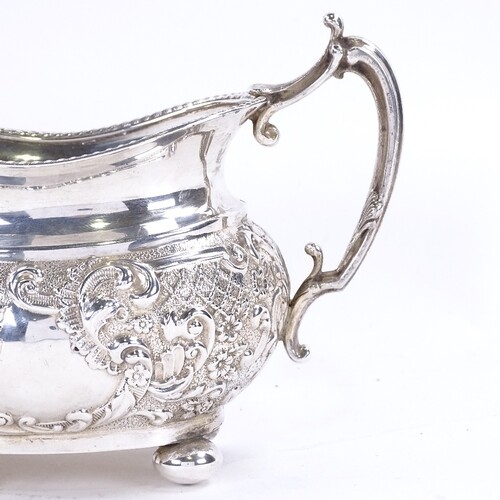 A late Victorian silver 2-handled sugar bowl, relief embosse...