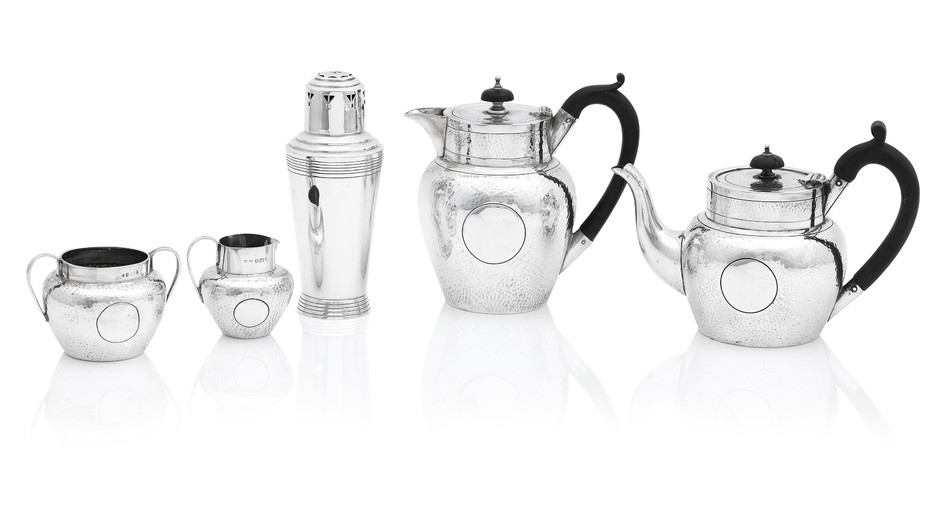 A matched four piece hammered silver bachelor's tea service