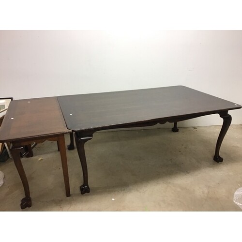 A modern South East Asian hard wood dining table with single...