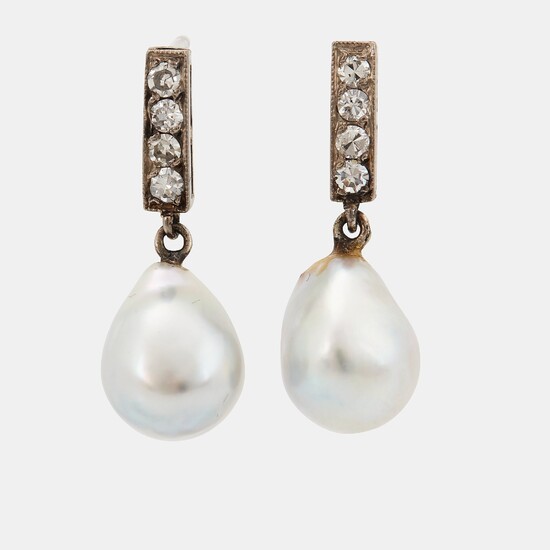 A pair of 18K white gold earrings set with drop formed pearls and eight-cut diamonds