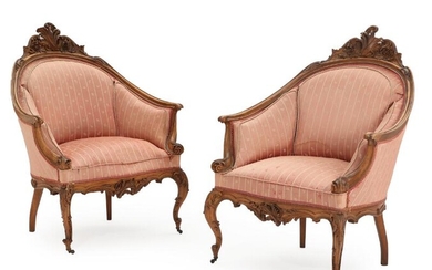 A pair of 19th century Neo Rococo walnut bergeres, richly carved with...