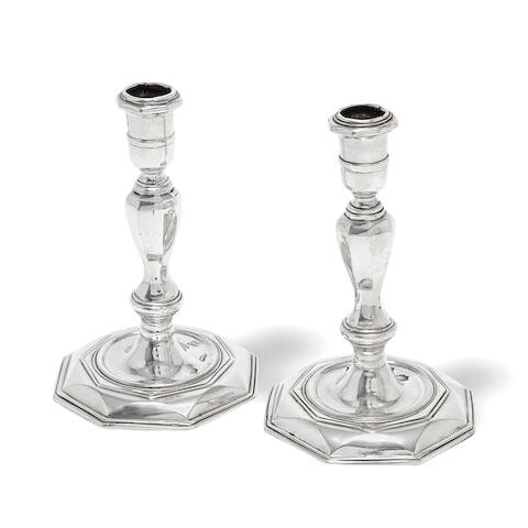 A pair of George I Irish silver candlesticks