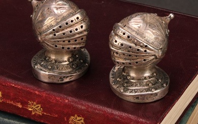 A pair of Victorian Gothic Revival silver novelty peppers, e...