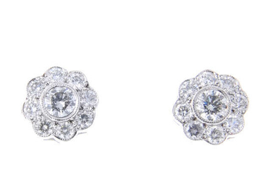 A pair of brilliant-cut diamond floral cluster earrings.
