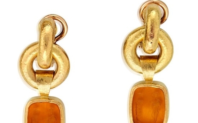 A pair of carved glass and nineteen karat gold...