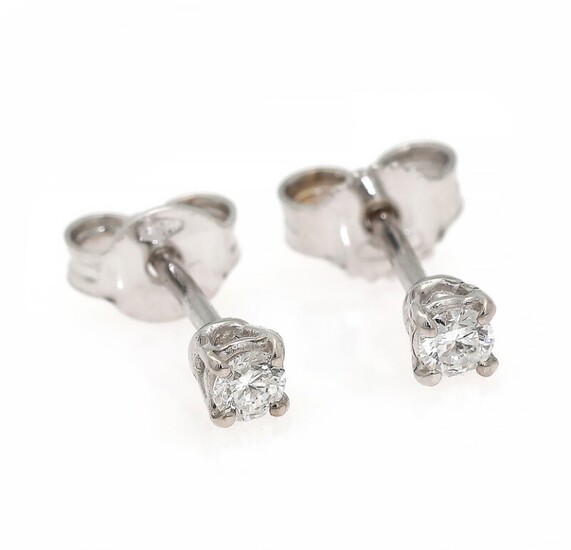 NOT SOLD. A pair of diamond ear studs each set with a brilliant-cut diamond weighing...