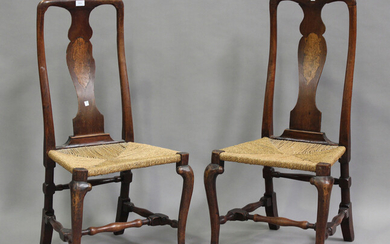 A pair of early 18th century walnut splat back side chairs, each with inlaid panels above woven stri