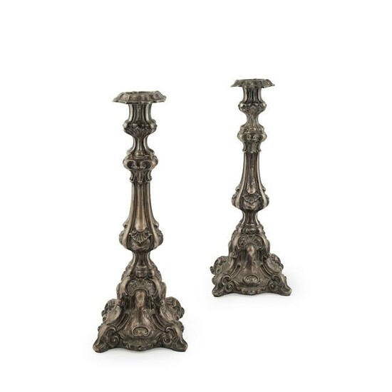 A pair of large Continental candlesticks