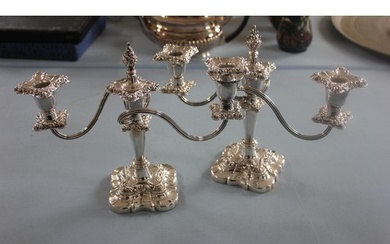 A pair of silver plated twin branch candelabra each 23cm hig...