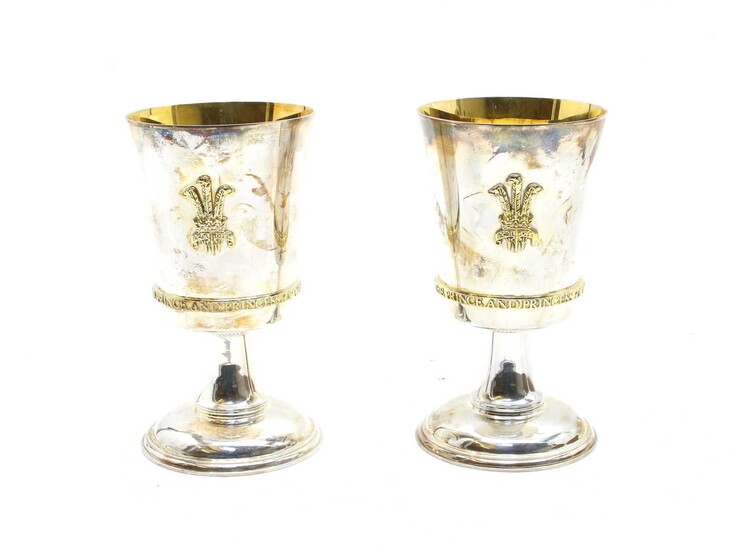 A pair of sterling silver commemorative goblets, by Garrard & Co.