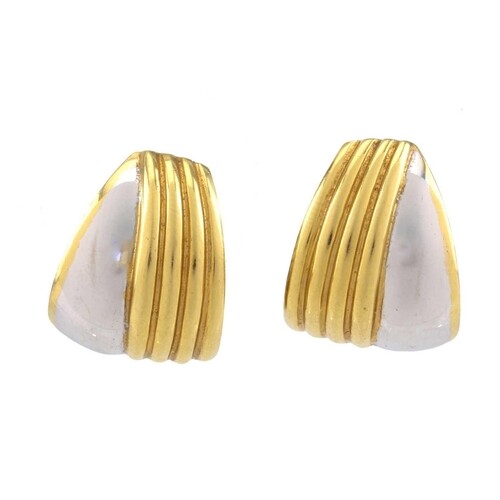 A pair of two-toned clip post earrings, each composed of a c...