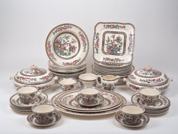 A part Bridgwood 'Ye Olde Indian Tree' pattern dinner service, 20th century, comprising: eight dining plates, 24cm diameter, eight luncheon plates, six soup bowls, five later soup bowls, two tureens and covers, three graduated serving platters, a...