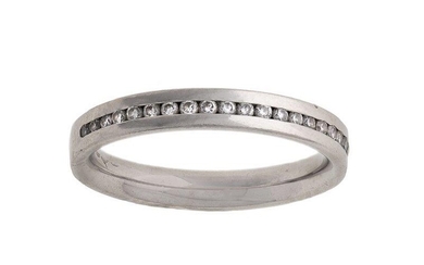 A platinum and diamond band ring, inset with a line of brilliant-cut diamonds, ring size K, British hallmarks for platinum