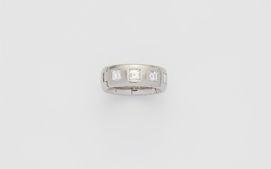 A platinum and diamond five stone ring adjustable in size.