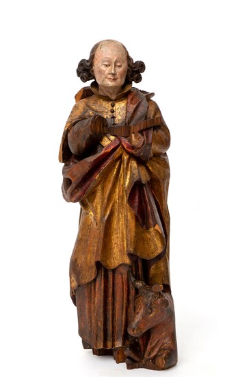 A polychrome painted carved limewood figure of Luke the Evangelist