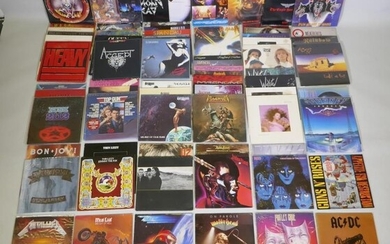 A quantity of 12" metal and rock vinyl LPs...