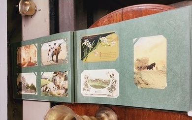 A really nice collection of antique post cards mounted in an...