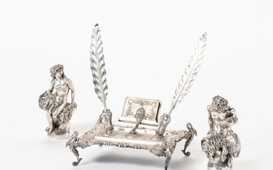 A silver inkstand and two silver mythological figures...