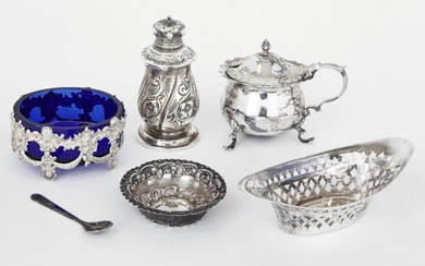 A small group of silver comprising: a Victorian silver pepper with hinged lid, London, 1885, Rosenthal, Jacob & Co.; a silver mustard, Chester, 1901, Jay, Richard Attenborough & Co; a blue glass salt in pierced silver mount, stamped 800; a silver...