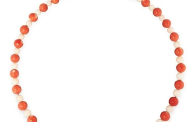 AN ANTIQUE CORAL AND ANGEL CORAL BEAD NECKLACE