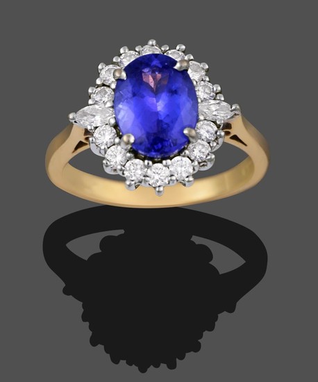 An 18 Carat Gold Tanzanite and Diamond Cluster Ring, the...
