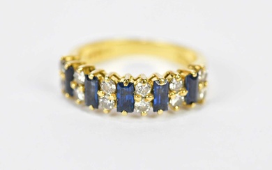 An 18ct yellow gold sapphire and diamond ring formed of...