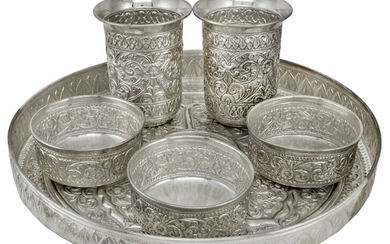 An Asian Silver Tray Set Comprising a repousse work galleried serving tray, diameter 12in, tog...