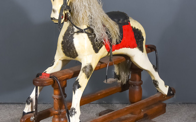 An Early 20th Century Black and White Dappled Rocking Horse,...