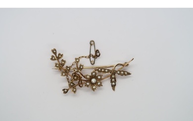 An Edwardian 9ct yellow gold hallmarked and pearl flower bro...