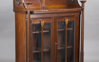 An Edwardian Arts and Crafts mahogany glazed bookcase, in the manner of Wylie & Lochhead, inlaid