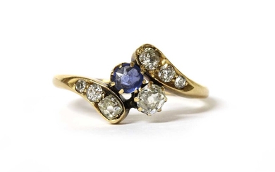An Edwardian gold sapphire and diamond crossover ring