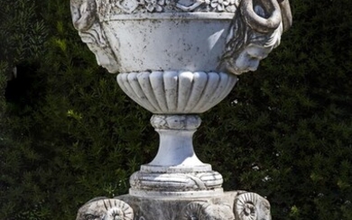 An Italian sculpted Carrara marble urn on pedestal