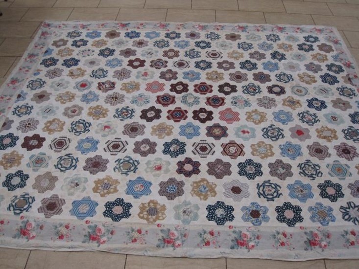 An early 20th Century hand stitched cotton patchwork Quilt...