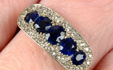 An early 20th century platinum and 18ct gold graduated sapphire five-stone ring, with single-cut diamond shared surround.